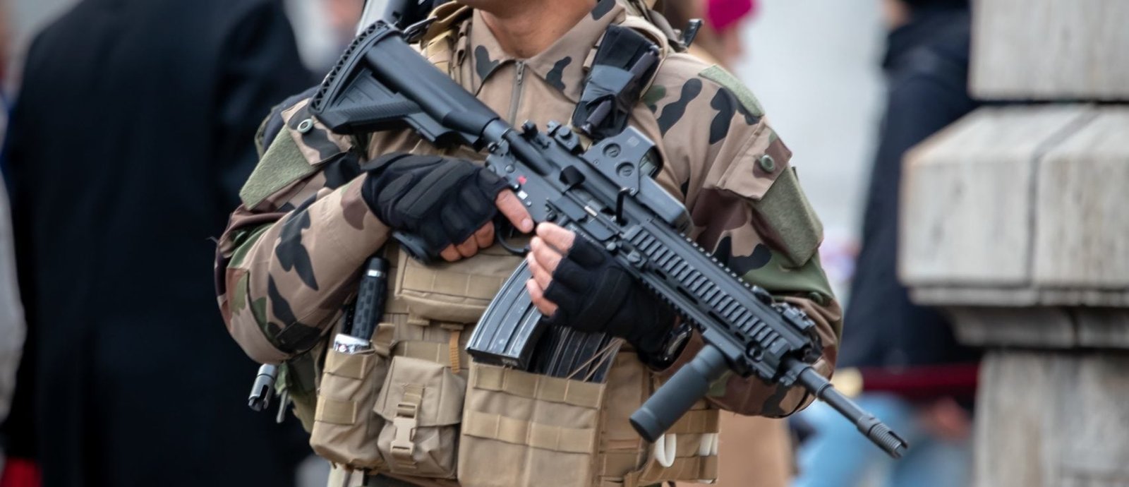 Legionnaire holding an HK-416 rifle