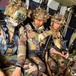 Legionnaires of the 2nd Foreign Infantry Regiment seated inside a helicopter during a tactical exercise.