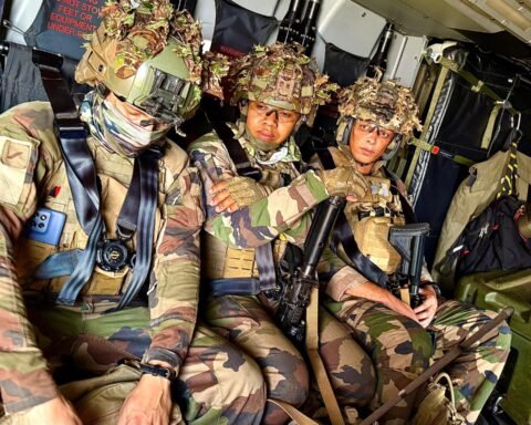 Legionnaires of the 2nd Foreign Infantry Regiment seated inside a helicopter during a tactical exercise.