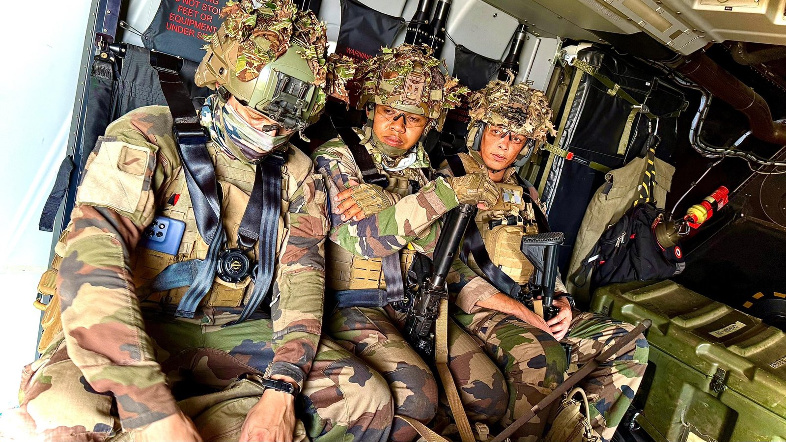 Legionnaires of the 2nd Foreign Infantry Regiment seated inside a helicopter during a tactical exercise.